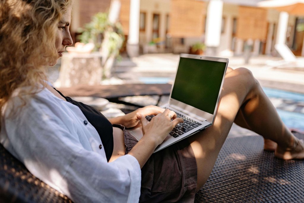 Woman working outside in nature, embracing a flexible and fulfilling career.