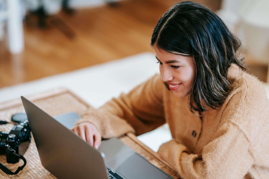sustainability and remote work are interconnected - Smiling woman engaged in a remote conference, promoting sustainable work practices